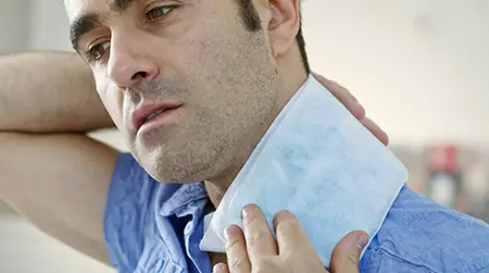 Warm Compress: Apply a warm compress on the neck to relax tight muscles.